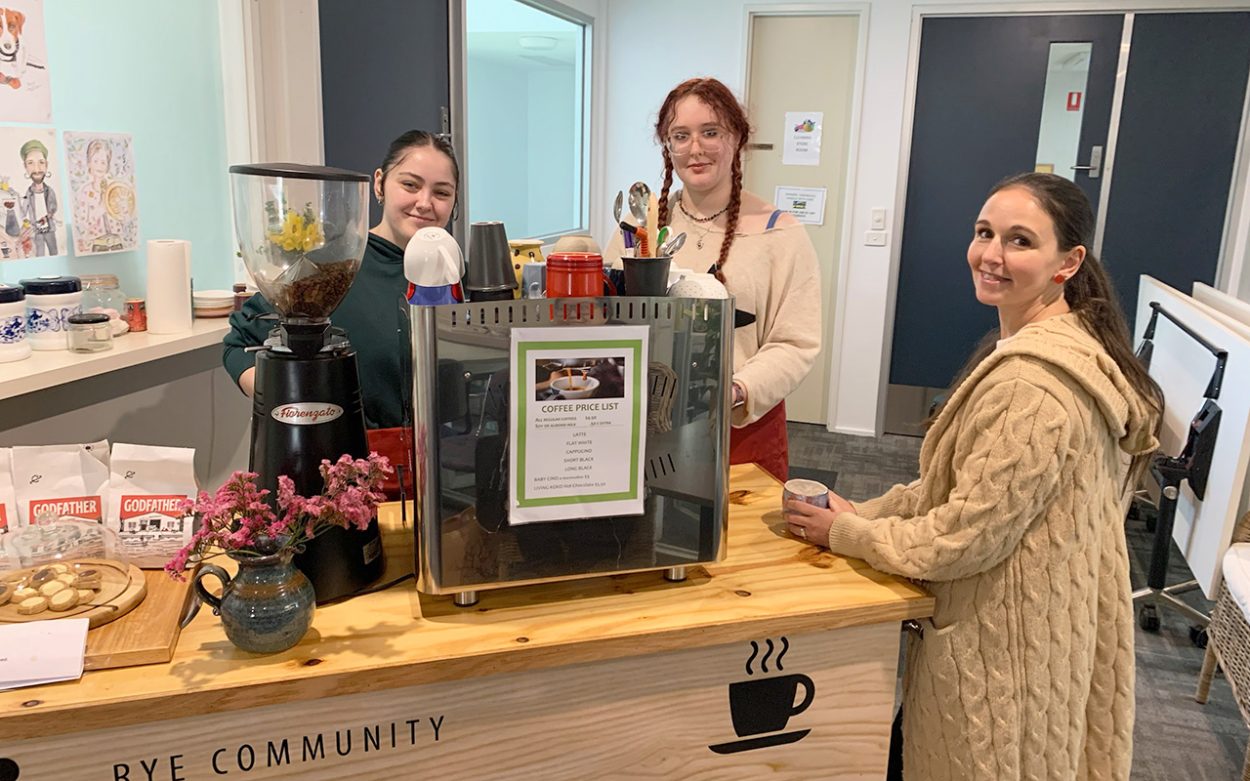 BARISTAS Danielle Barbuto and Madi Worrell with customer Tegan at Rye Community House. Picture: Supplied