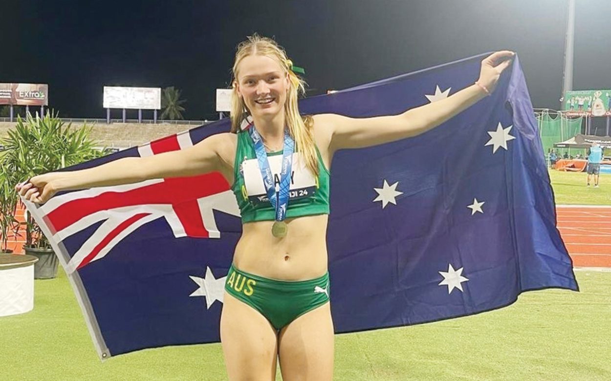 Geena Davy celebrates snaring first place in the Oceania Athletics Championships under 18 long jump in Fiji. Picture: Supplied