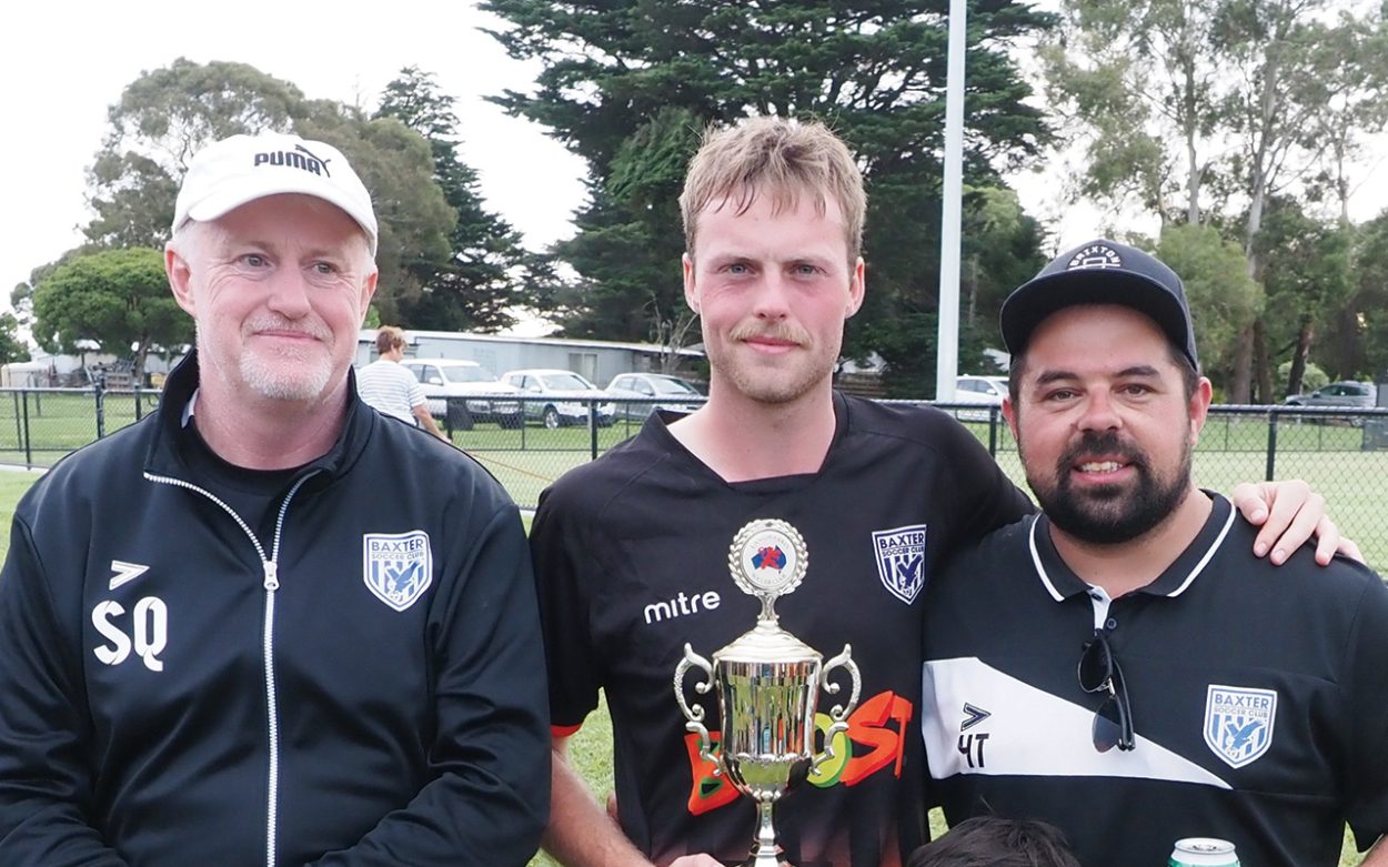 Taylor trio: Kevin “Squizzy” Taylor (left) and new Baxter senior coach Hayden Taylor (right) flank Baxter defender and family member Daniel Taylor. Picture: Darryl Kennedy