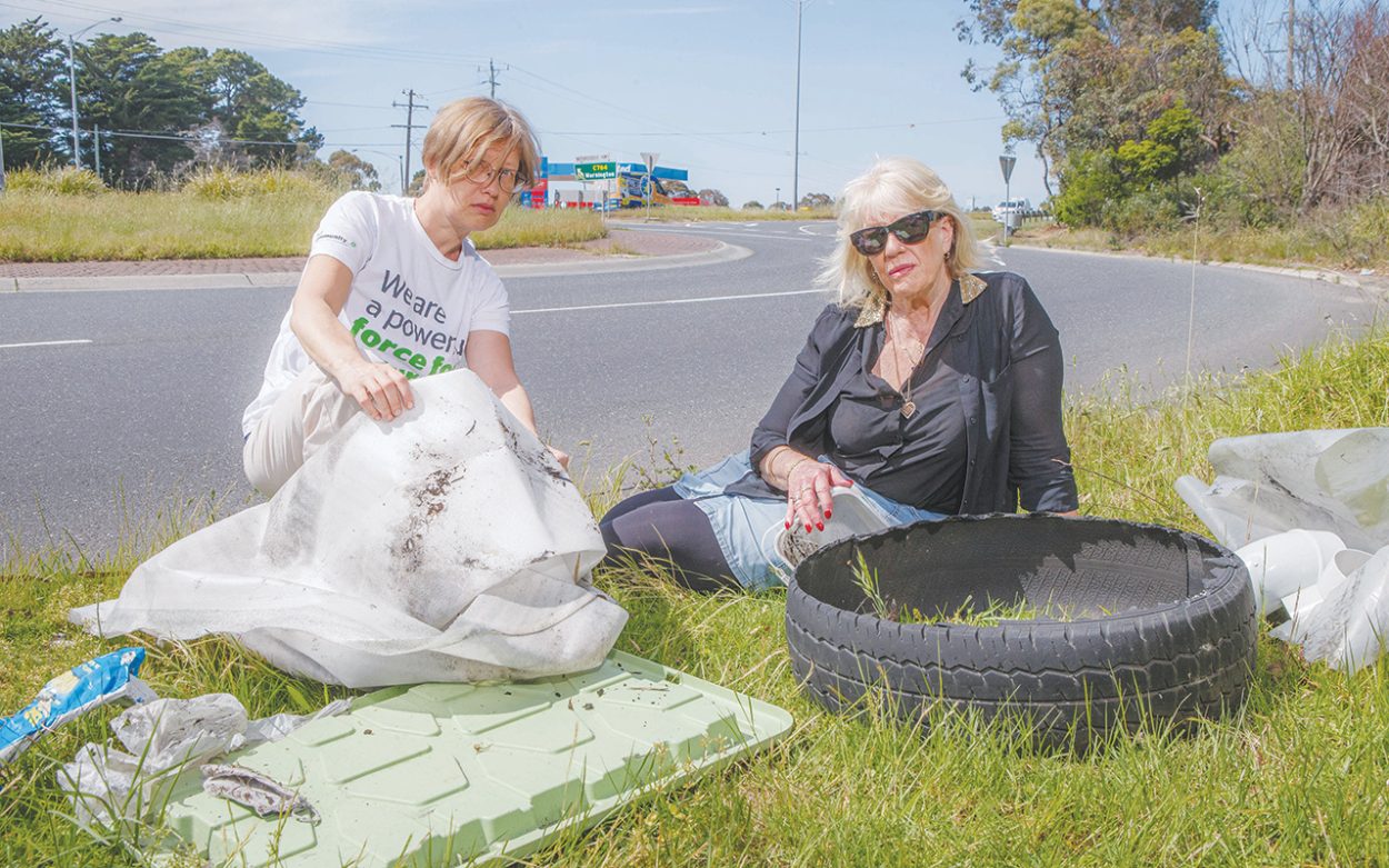 MARIA Remova and Sue Miles from the Australian Conservation Foundation (Mornington Community Group), with rubbish on the side of the road at Baxter roundabout. Picture: Gary Sissons